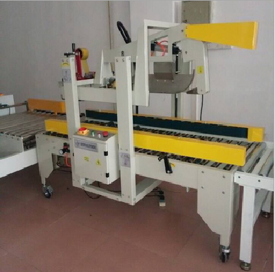 Adhesive tape sealing machine