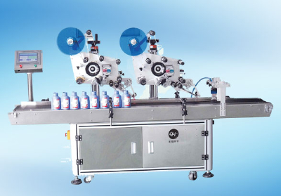 Horizontal round bottle labeler