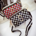 Inclined shoulder bag
