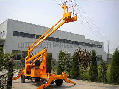 Curved arm aerial work vehicle