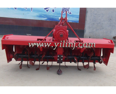 Heavy rotary tiller with side gear