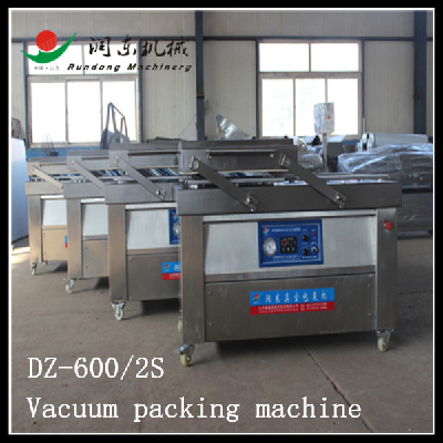 Double vacuum chamber packaging machine