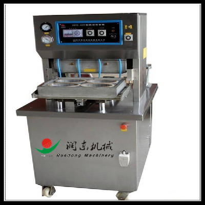 Food tray vacuum packaging machine